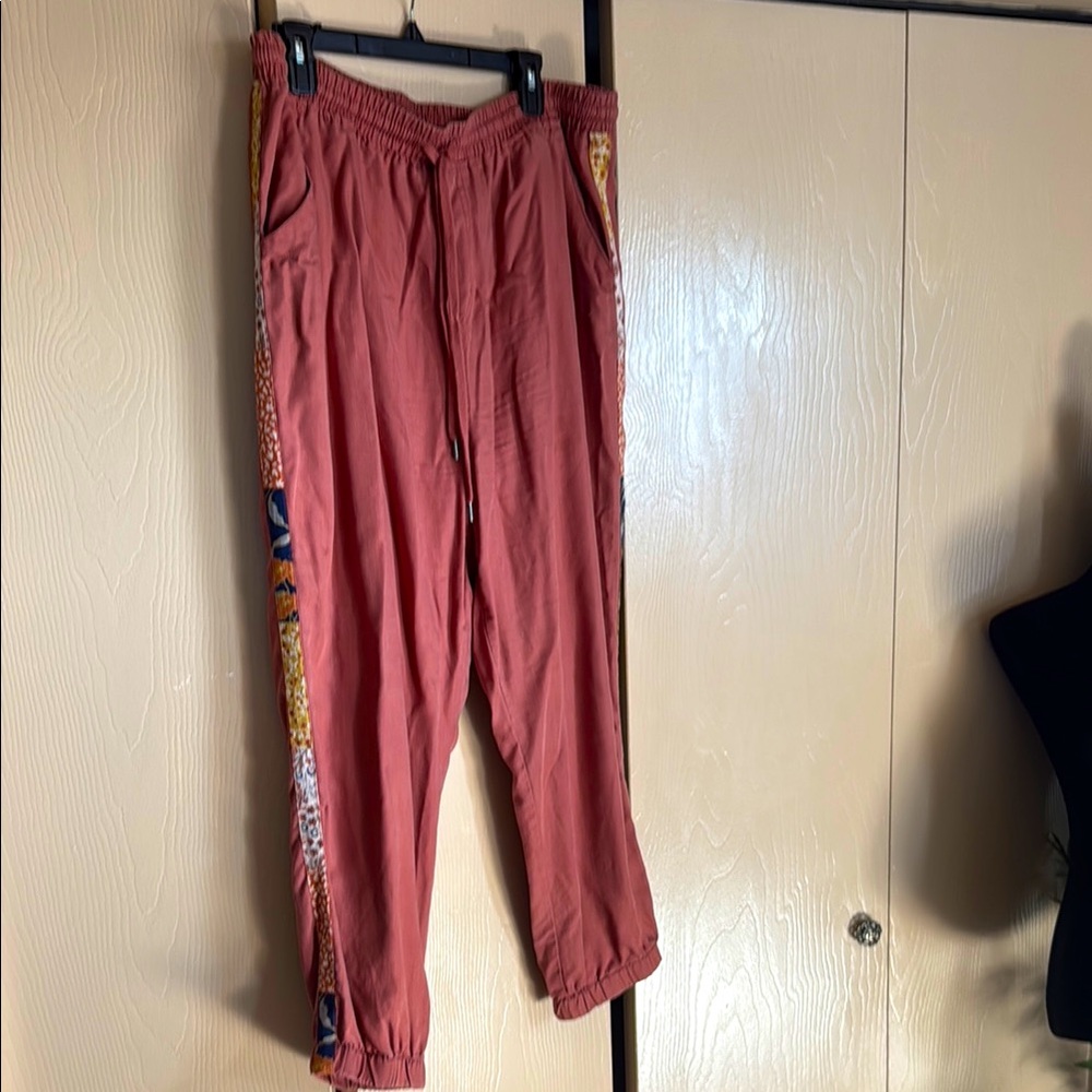 Capri length drawstring summer pants with side details.